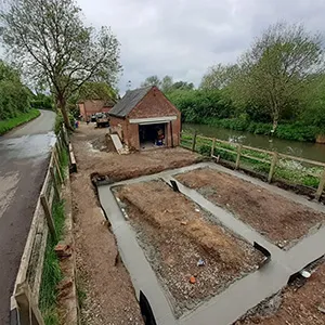 a picture of a construction site next to a river