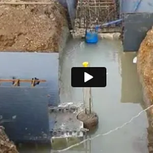 a video of a man standing in the middle of a body of water