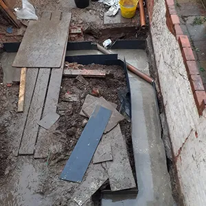 a pile of rubble sitting next to a building