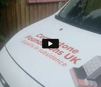 A white car with a sticker on it.
