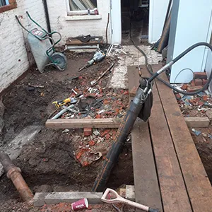 a pile of rubble next to a building