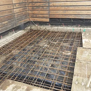 a concrete floor with a grate in the middle of it