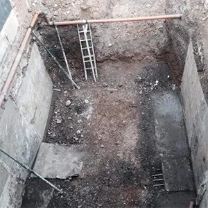 A bathroom that is under construction with a ladder.