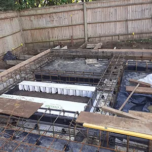 a man is standing in a building that is under construction