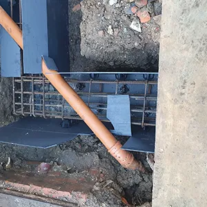 a pipe sticking out of a hole in a wall