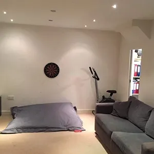 A living room filled with furniture and a flat screen tv.