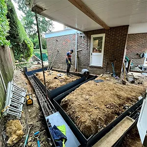 A man working on a house under construction.